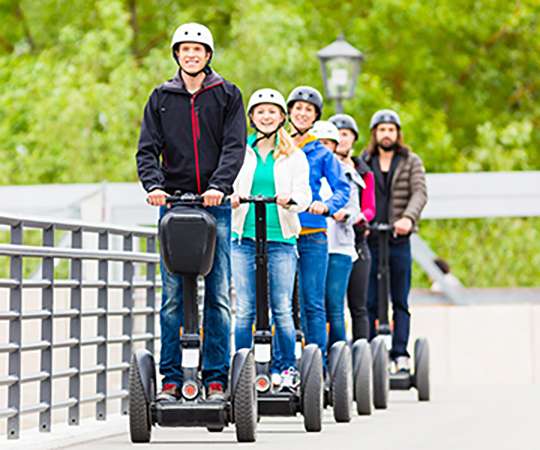 Tourist group having guided Segway city tour in Germany
